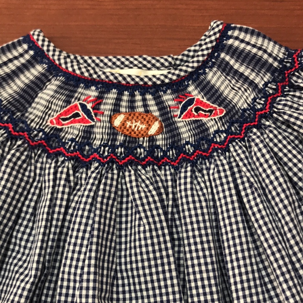 New with tags from Rosalina hand smocked dress